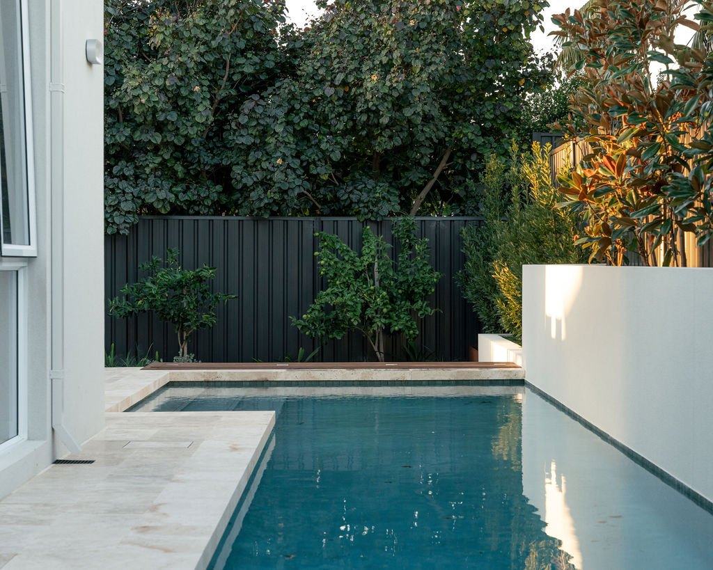Timber deck and steps leading to the pool and house