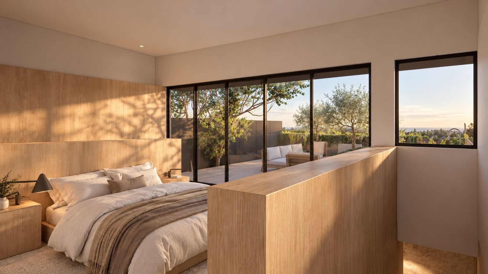 Upper bedroom with timber wall panelling opening onto a terrace with olive trees and a distant ocean view
