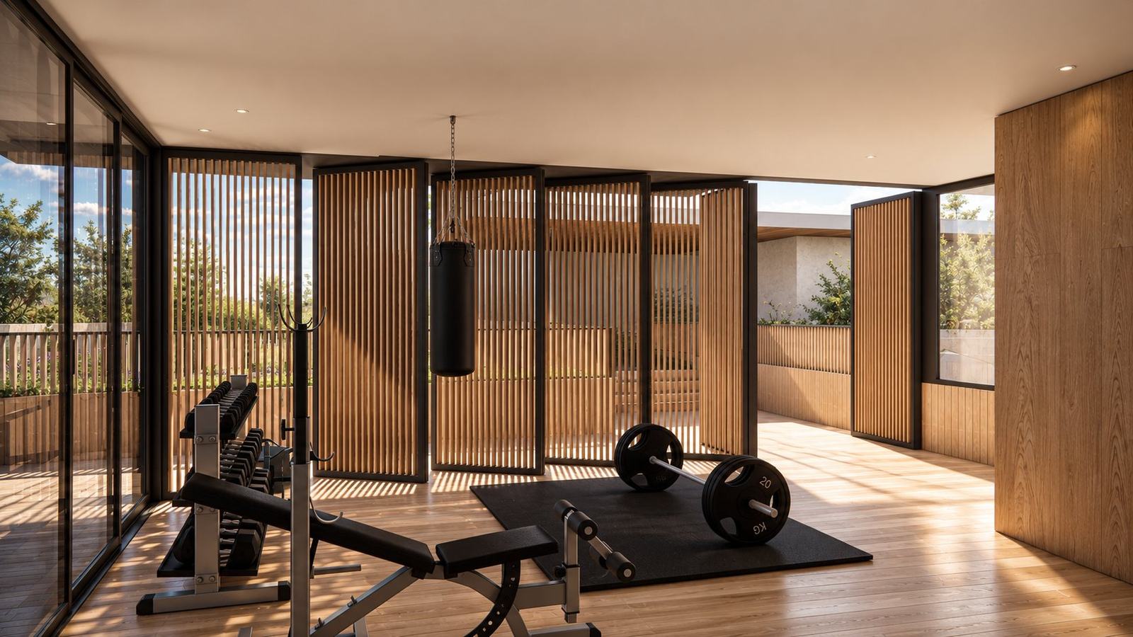 Gym opening onto the terrace through folding timber screens