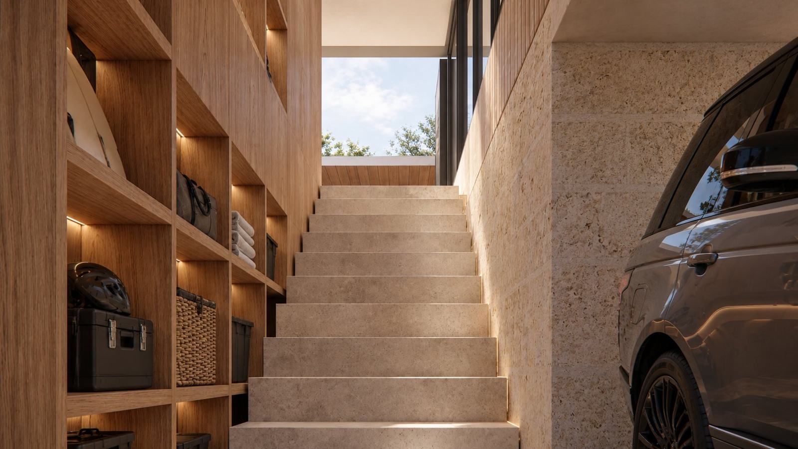 Limestone stair rising from the garage past lit timber storage shelving