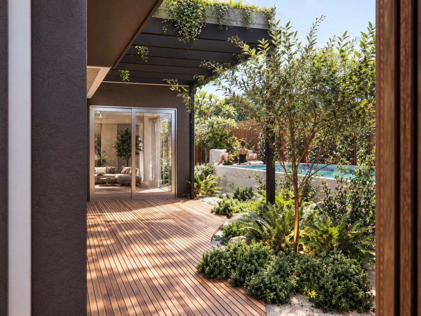 Timber deck under a black pergola trailing greenery, with the pool and garden beyond